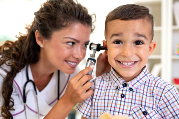 istock Otoscope ear examination performed by a young doctor 1055392686