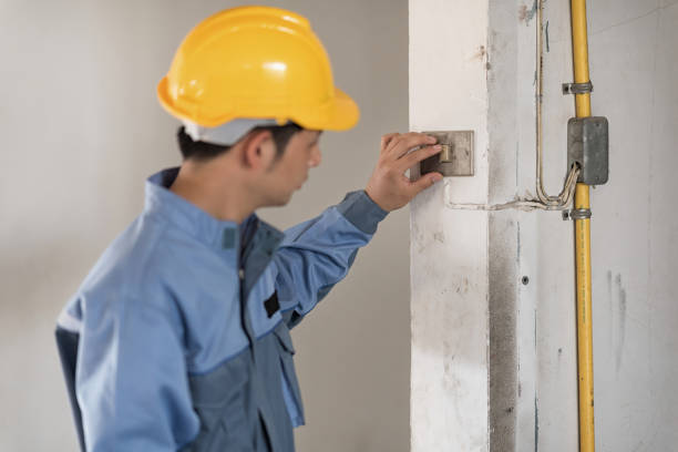 istock technician man working with wearing yellow safety helmet 1055397032