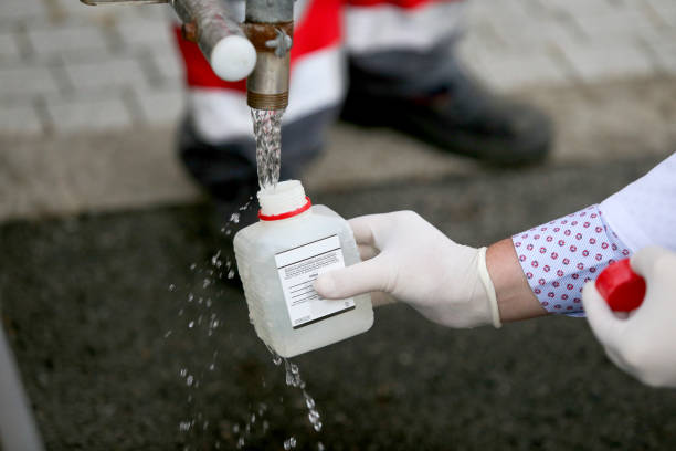 istock Doctor testing the water from a tank 1055397820