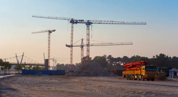 istock cranes and truck with concrete pump 1055398202