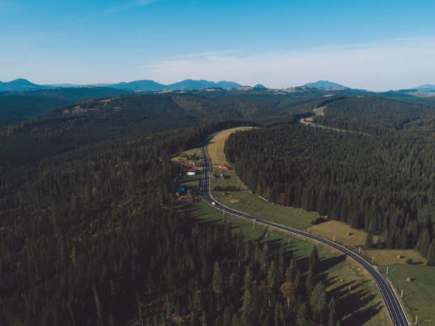 istock High Angle View Of Road Amidst Mountains Against Sky 1055398658