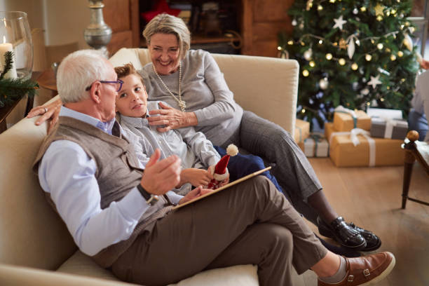 istock Celebrating Christmas, happy people at home. 1055406532