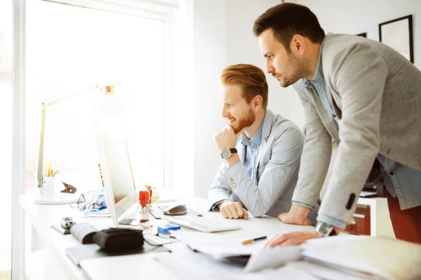 istock Group of business people working as team in office 1055408158