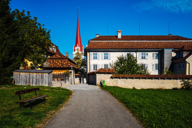istock Houses Amidst Trees And Buildings Against Blue Sky 1055409548
