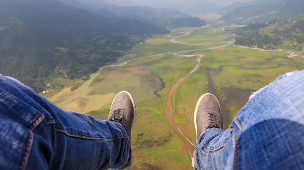 istock Legs straight out during paragliding 1055415544