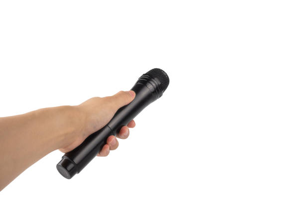 istock Microphone with hand holding toward isolated on white background, with clipping path 1055417248