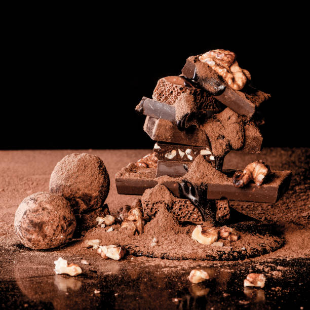 istock Truffles and chocolate with nuts. Black background. 1055420028