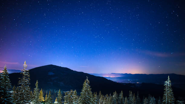 istock Night stars and milky way in winter 1055420128