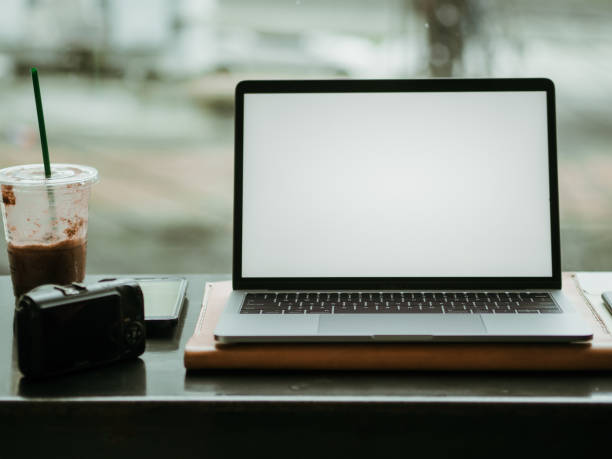 istock Empty screen laptop with camera and ice coffee in the cafe. 1055424154