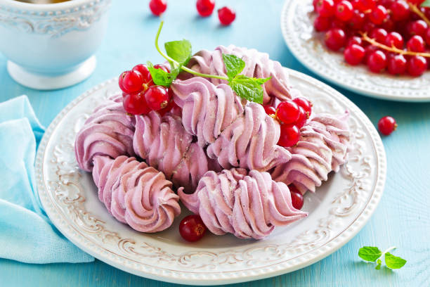 istock Homemade marshmallows with fresh berries. 1055425140