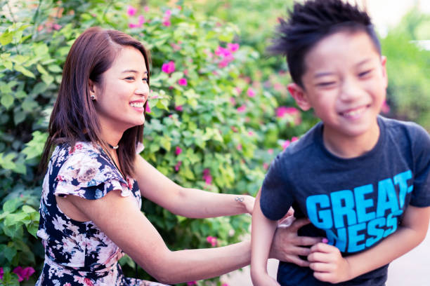 istock Mother and Son playing at the Park 1055426608