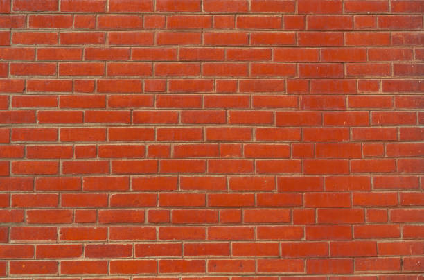 istock Orange brick wall texture background. Background for text. Exterior architecture concept. 1055426734