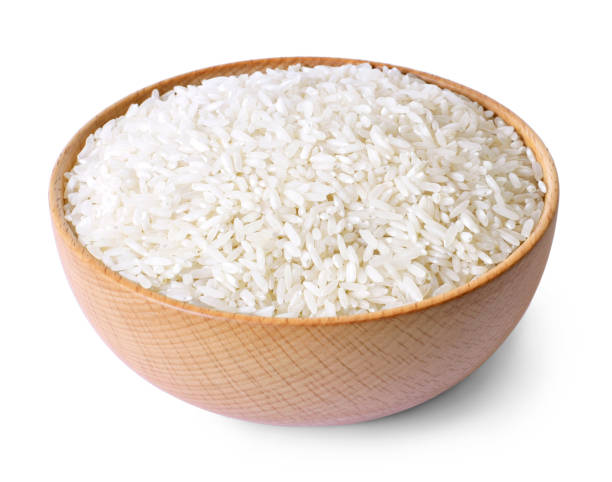 istock Raw, parboiled rice in a wooden bowl 1055427108
