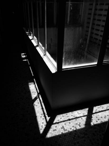 istock sunlight from glass window in black and white 1055432568