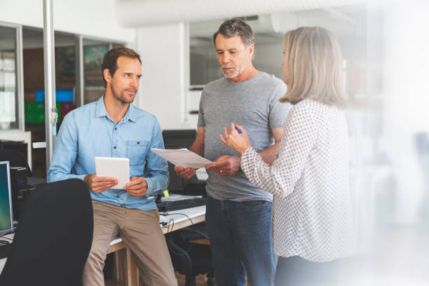 istock Confident entrepreneurs discussing at office 1055437438