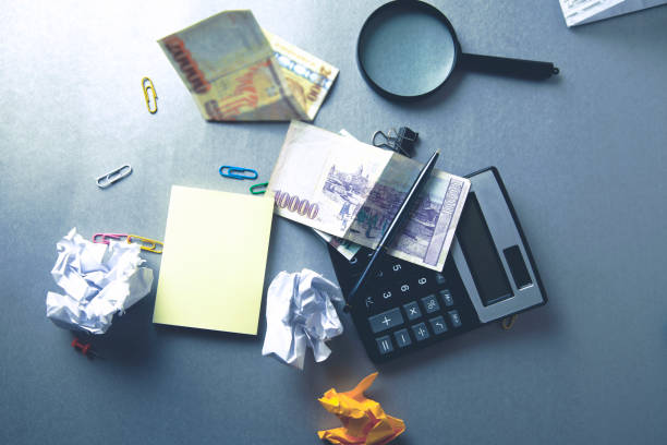 istock stationary and money on desk 1055442176