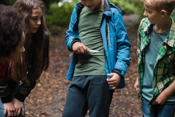 istock Young Boy Brandishing a Knife 1055443198