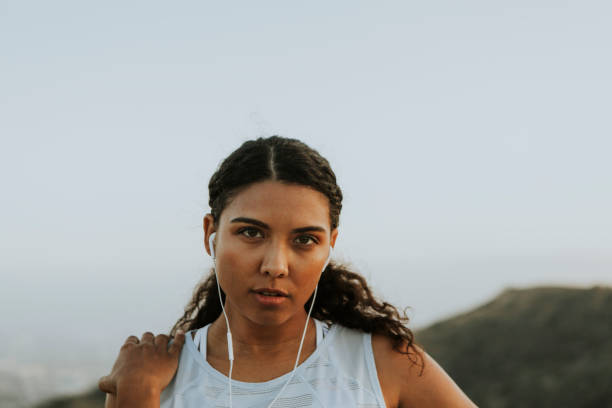 istock Woman working out while listening to music 1055445164