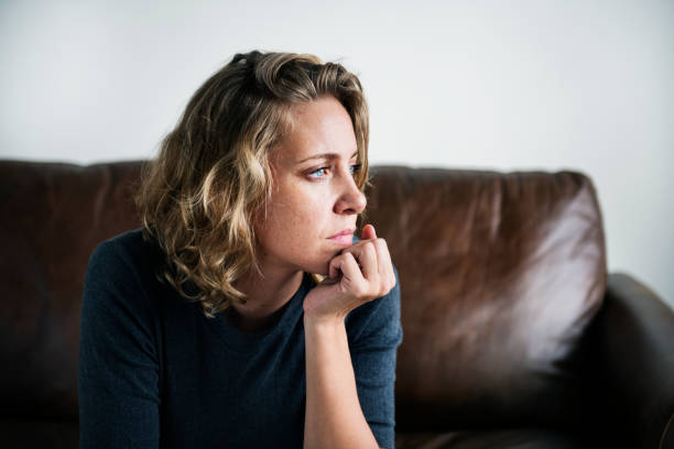 A person suffering from depression A person suffering from depression one woman only stock pictures, royalty-free photos & images