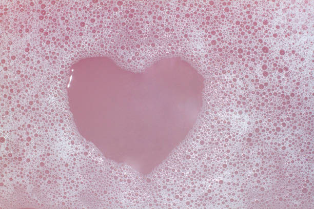 Heart Shaped Bubbles.Abstract, Foam bubbles white background. Detergent Heart Shaped Bubbles.Abstract, Foam bubbles white background. Detergent soap sud foam bubble laundry stock pictures, royalty-free photos & images