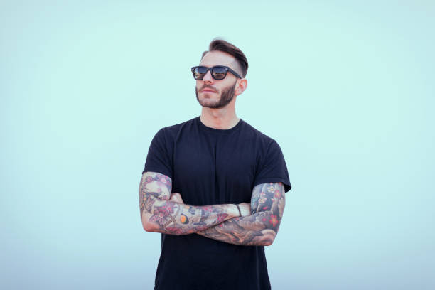 istock Portrait of tattooed young man 1055451330