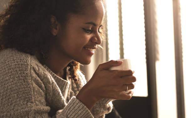 istock Woman having a warm cup of coffee 1055452140
