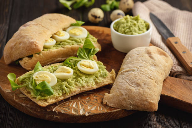 istock Avocado sandwich ciabatta with quail eggs. 1055452152