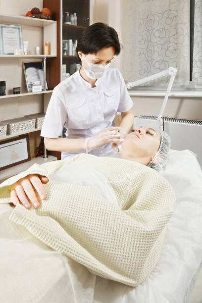 Injection to face stock photo