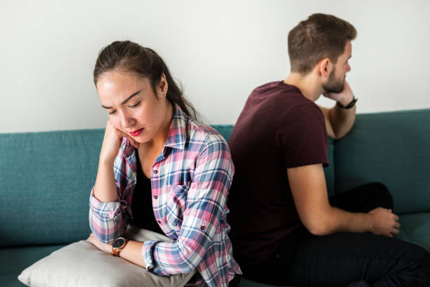 istock Unhappy couple not talking to one another 1055454092