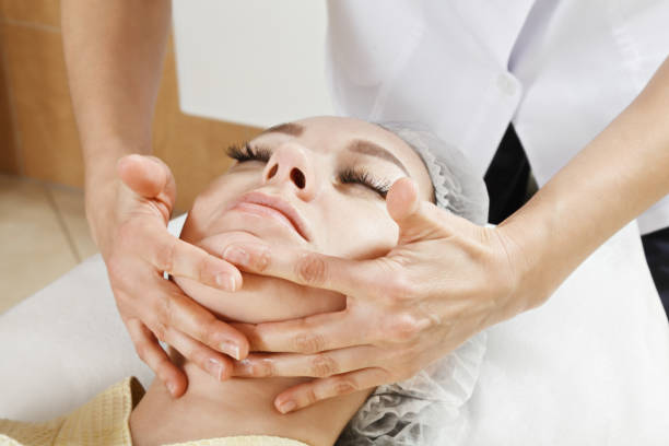 Face massage stock photo