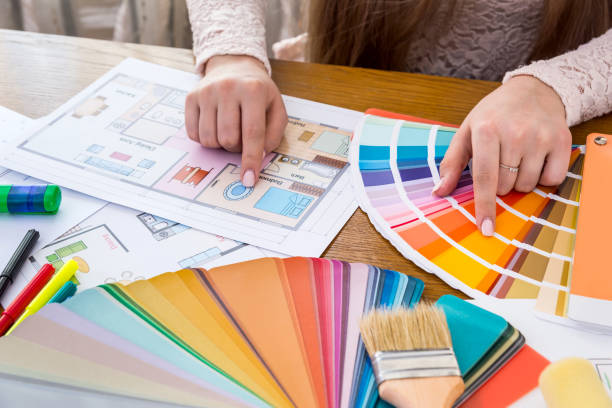 istock Female hands choosing colour for bedroom walls 1055454408