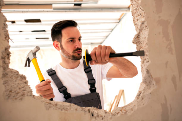 istock Carving a hole in the wall 1055457378