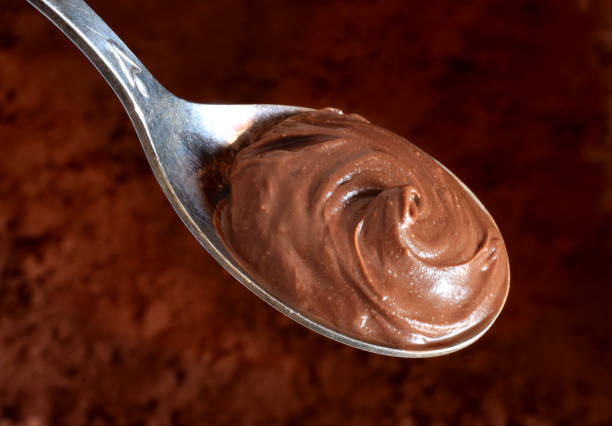 istock Chocolade butter in spoon closed up 1055459860