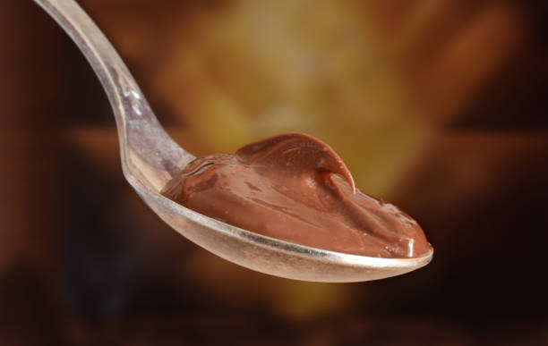istock Chocolade butter in spoon closed up 1055460094