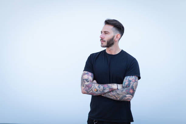 istock Portrait of tattooed young man 1055460616