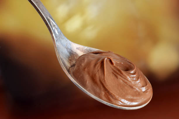istock Chocolade butter in spoon closed up 1055460948