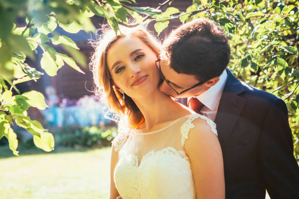 istock bride and groom on background summer forest 1055461364