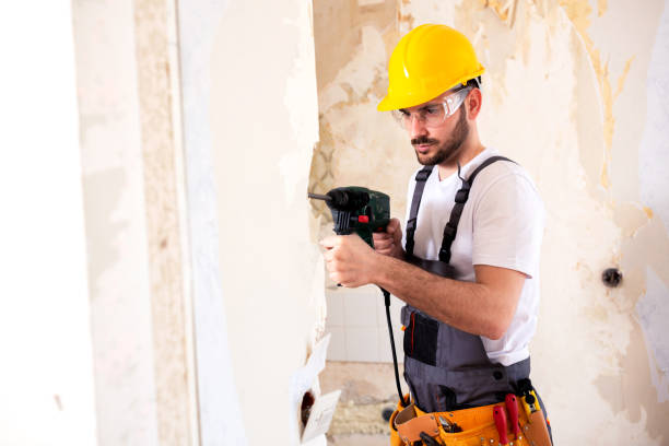 istock Worker wearing a yellow protective helmet 1055461970