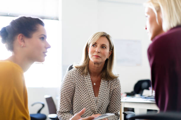 istock Female entrepreneurs brainstorming at workplace 1055464440
