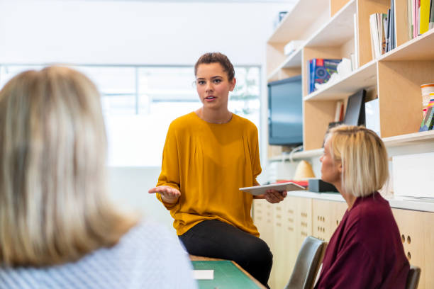 istock Young businesswoman planning with colleagues 1055464780