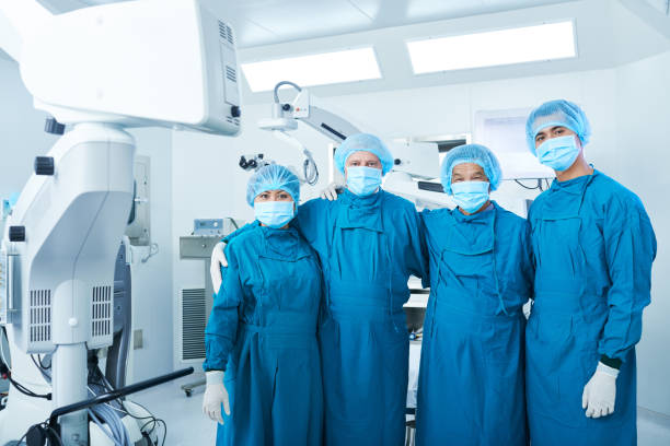 istock Surgical team near modern equipment 1055469266