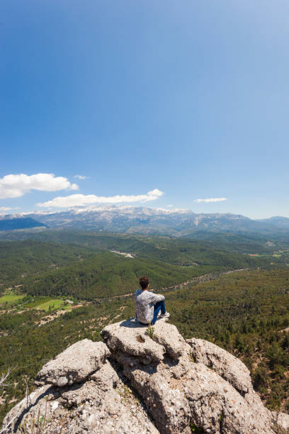 istock Traveler Sitting at the Edge 1055470578