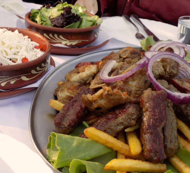 istock Various grilled meat on a metal plate on the table in the restaurant 1055470632