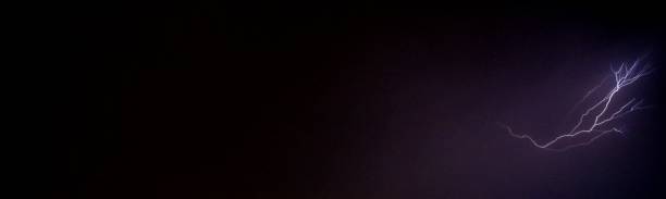 istock Lightning bolt at a dark night. Left space of picture free for text. 1055470716