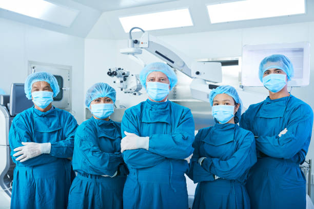 Confident Asian surgeons looking at camera