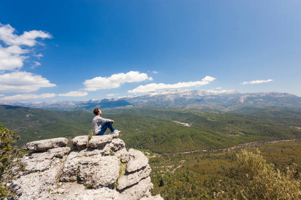 istock Traveler Sitting at the Edge 1055470854