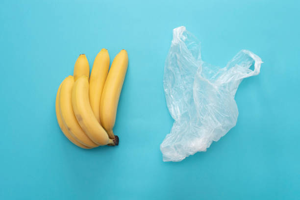 istock Yellow ripe fresh bananas and transparent plastic bag 1055471206