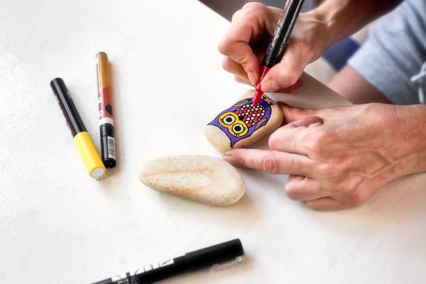 istock Caucasian woman stone painting 1055475542