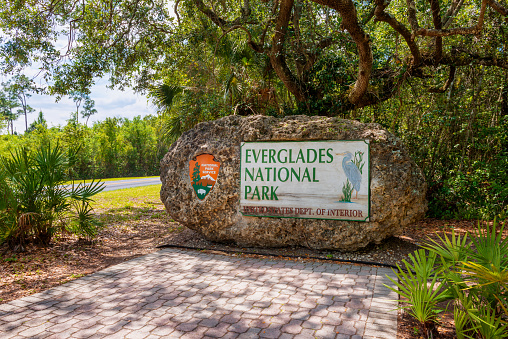 Everglades National Park, Florida, USA - March 30, 2015: Entrance sign to Everglades National Park in Florida, USA. The Everglades is a natural region of tropical wetlands.