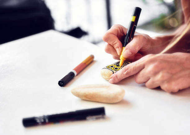istock Caucasian woman stone painting 1055476832